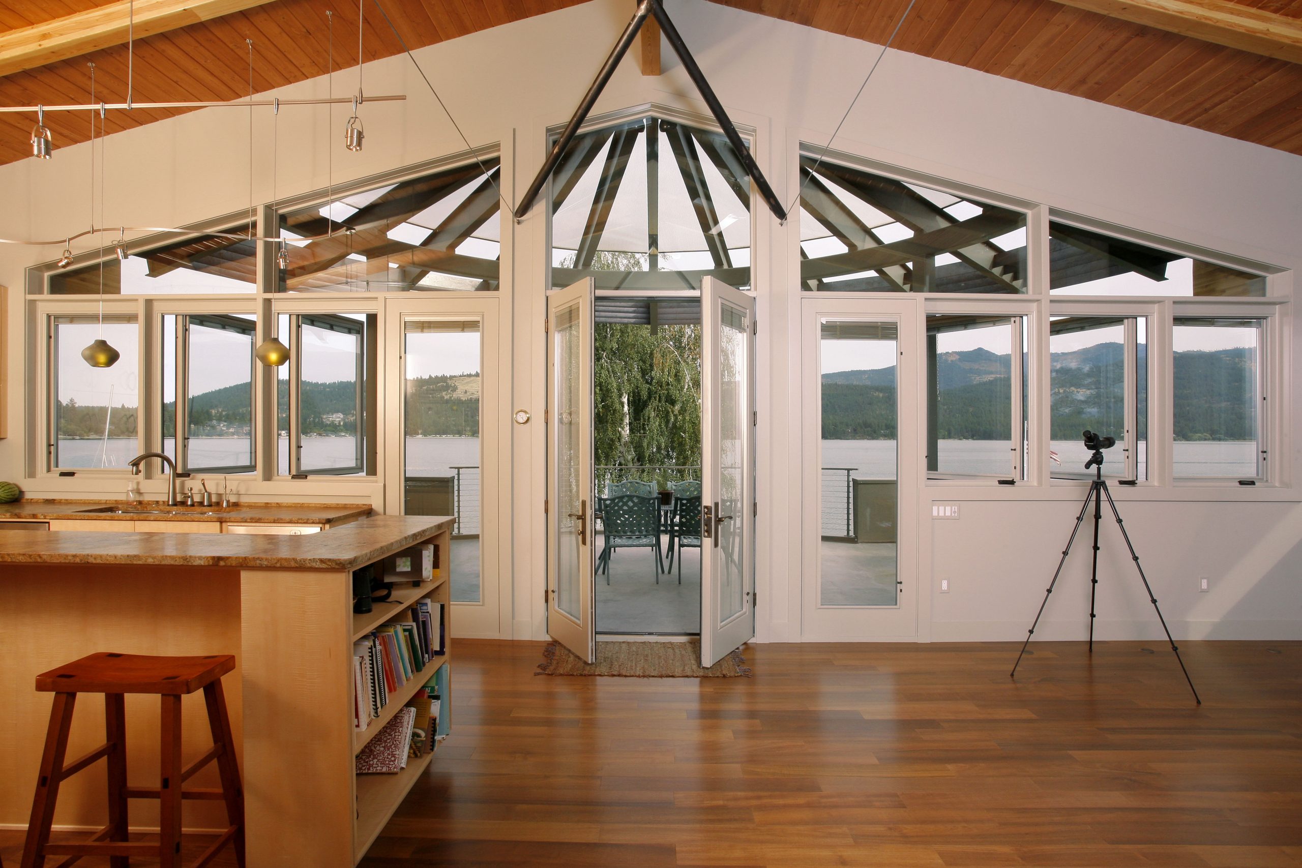 Photo looking out from the kitchen and living room to the back patio of the Liberty Lake home.